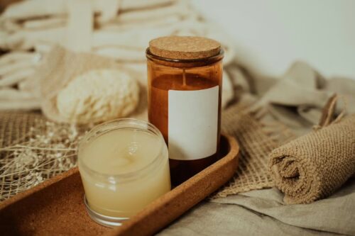 Candles in Glass Containers on a Wooden Tray